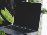 black asus laptop computer on brown wooden table