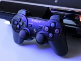 black Sony PS2 controller on white surface