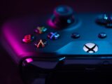 Detailed image of a game controller with colorful LED lighting