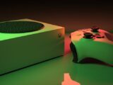 Close-up of an Xbox Series console and controller with dynamic lighting, showcasing modern gaming technology.