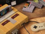 a nintendo game system sitting on top of a wooden table