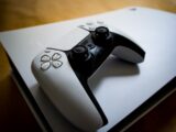 A playstation 5 console with its controller.