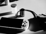 A game console, film roll, and mouse are shown.