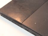 a laptop computer sitting on top of a white table