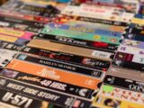 a bunch of different types of dvds on a table