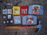 a collection of nintendo games and tools laid out on the ground