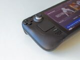 Detailed view of a handheld gaming console showcasing game selection on its screen.