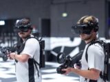 a couple of men wearing virtual reality headsets