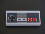 white and black nintendo game controller
