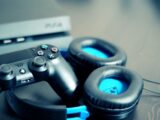 black Sony PS4 controller and black Turtle Beach headphones