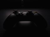 shallow focus photography of black Xbox controller