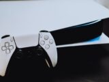 a close up of two video game controllers