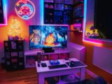 a living room with a television and a game system