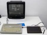 black crt tv beside white computer keyboard