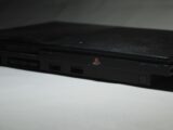 a black laptop computer sitting on top of a white table