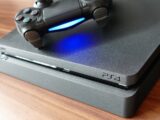 a video game console sitting on top of a wooden table