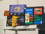 Stack of vintage video game console boxes on a shelf