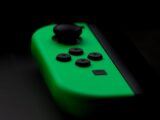 close-up photography of Nintendo Switch neon green controller