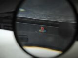 a close up of a magnifying glass with a logo on it