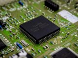 a close up of a computer chip on a printed circuit board