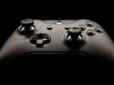 A detailed close-up of a modern gaming controller highlighting its design and functionality.
